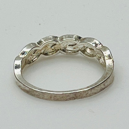 Rear view of sterling silver eternity ring showing 925 stamp and braided form