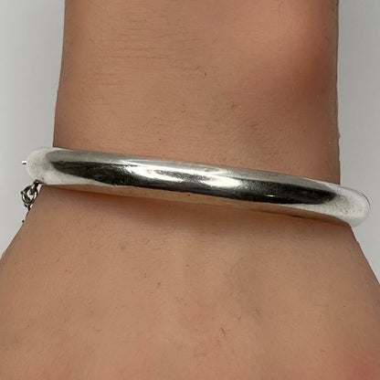 Sterling silver vintage bangle bracelet on wrist – smooth polished finish