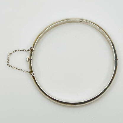 Full view of 1980s bangle with safety chain, laying flat