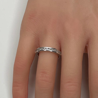 Sterling silver bridal set on model hand with princess-cut solitaire