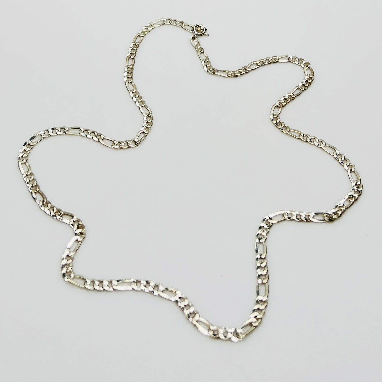 Sterling silver Figaro chain necklace with polished finish