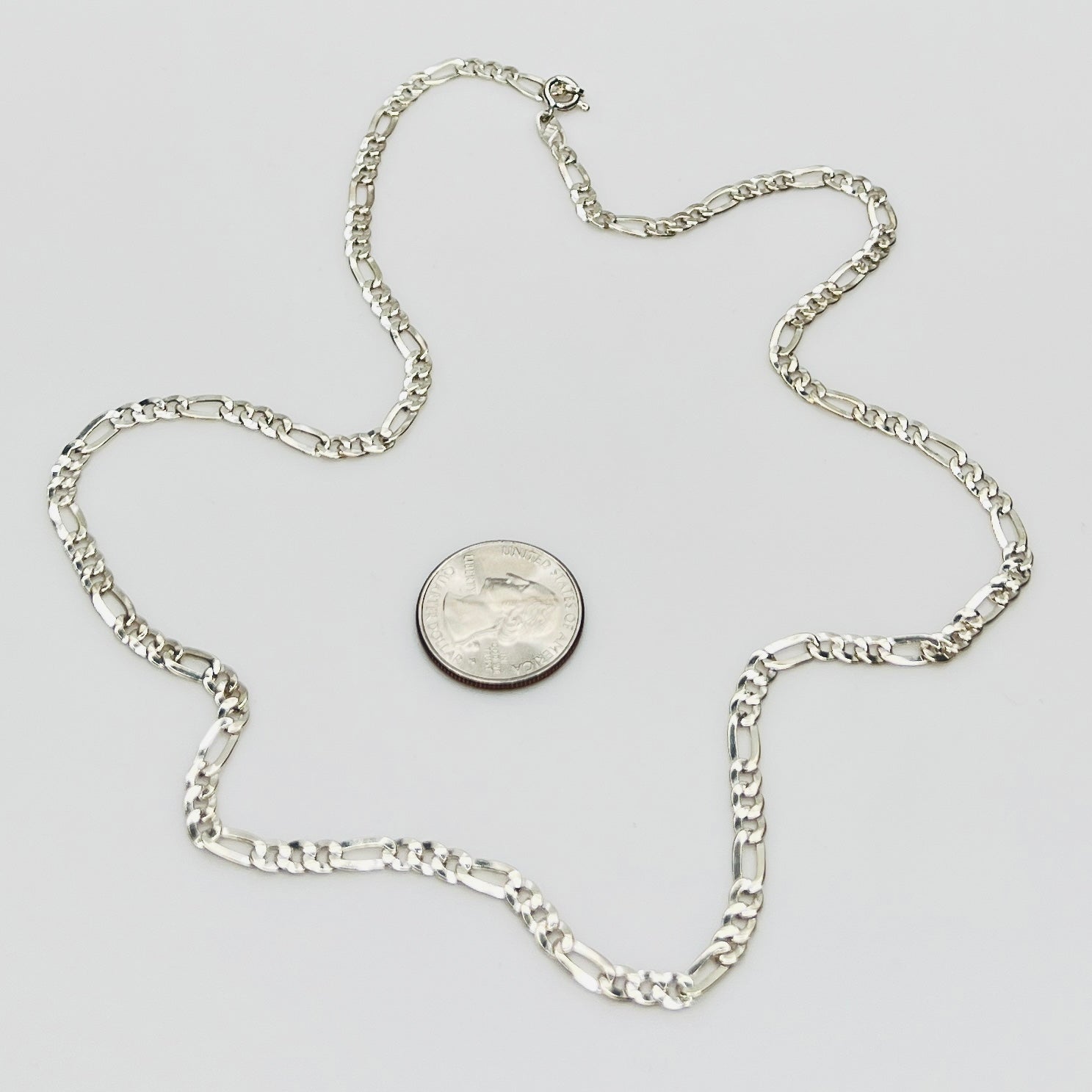 Sterling silver Figaro chain necklace with polished finish