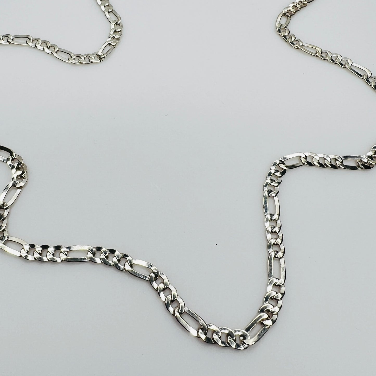 Sterling silver Figaro chain necklace with polished finish