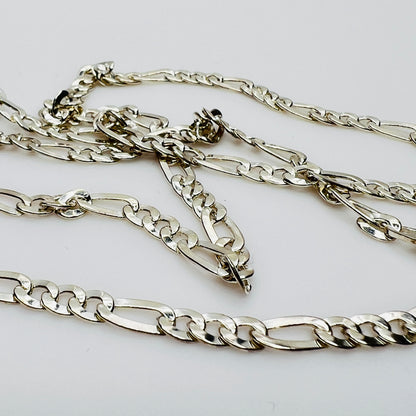Close-up of sterling Figaro links in bright silver finish