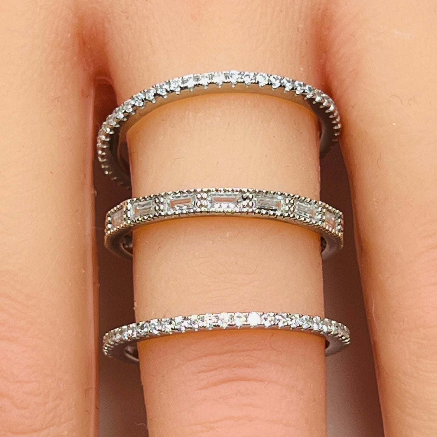 Sterling silver crystal ring trio stacked on hand