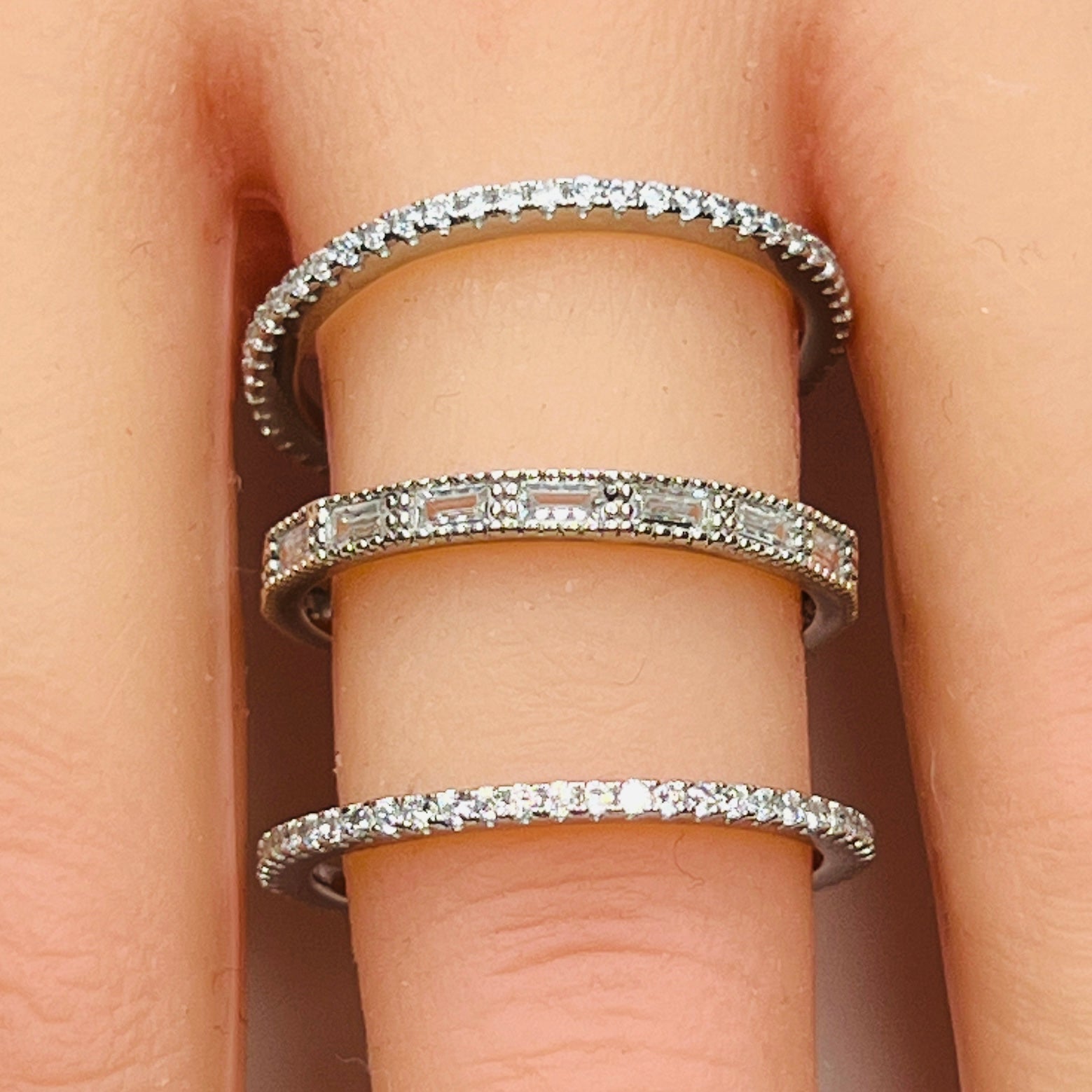 Sterling silver crystal ring trio stacked on hand