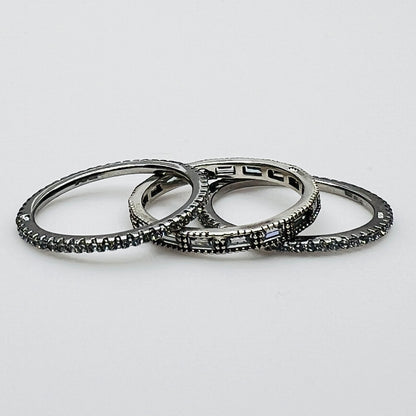 Close-up of 3 crystal eternity bands with baguette and pavé styles