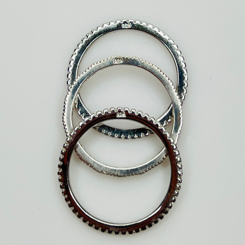 Underside view showing “925” stamp on each sterling band