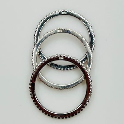 Underside view showing “925” stamp on each sterling band