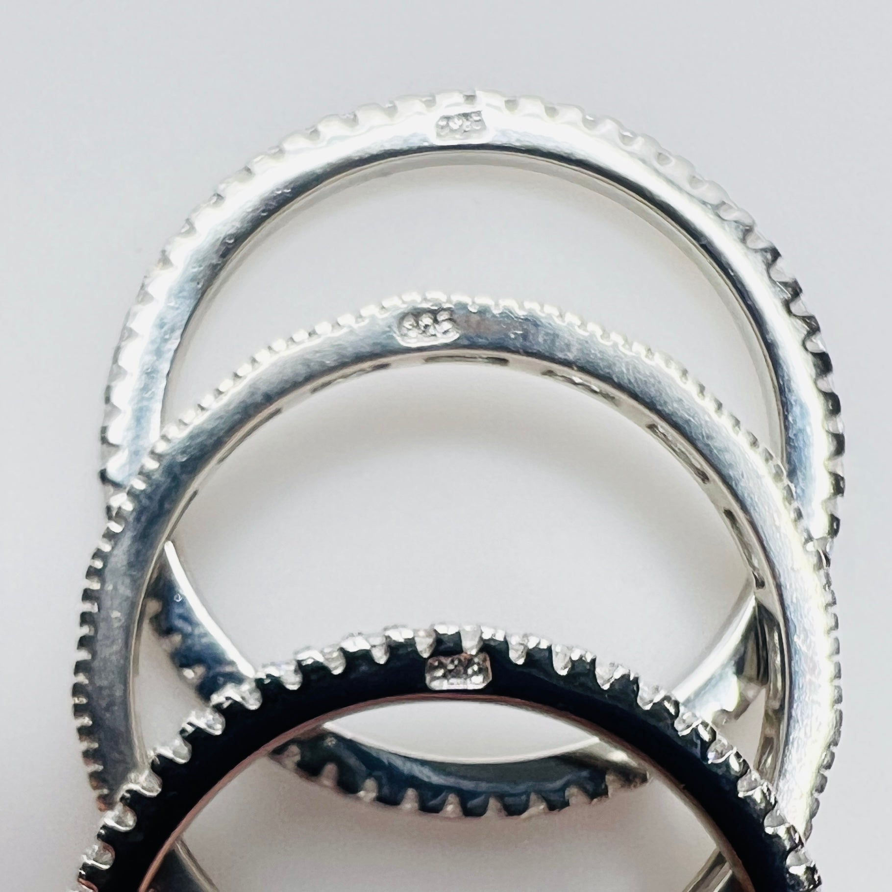 Underside view showing “925” stamp on each sterling band