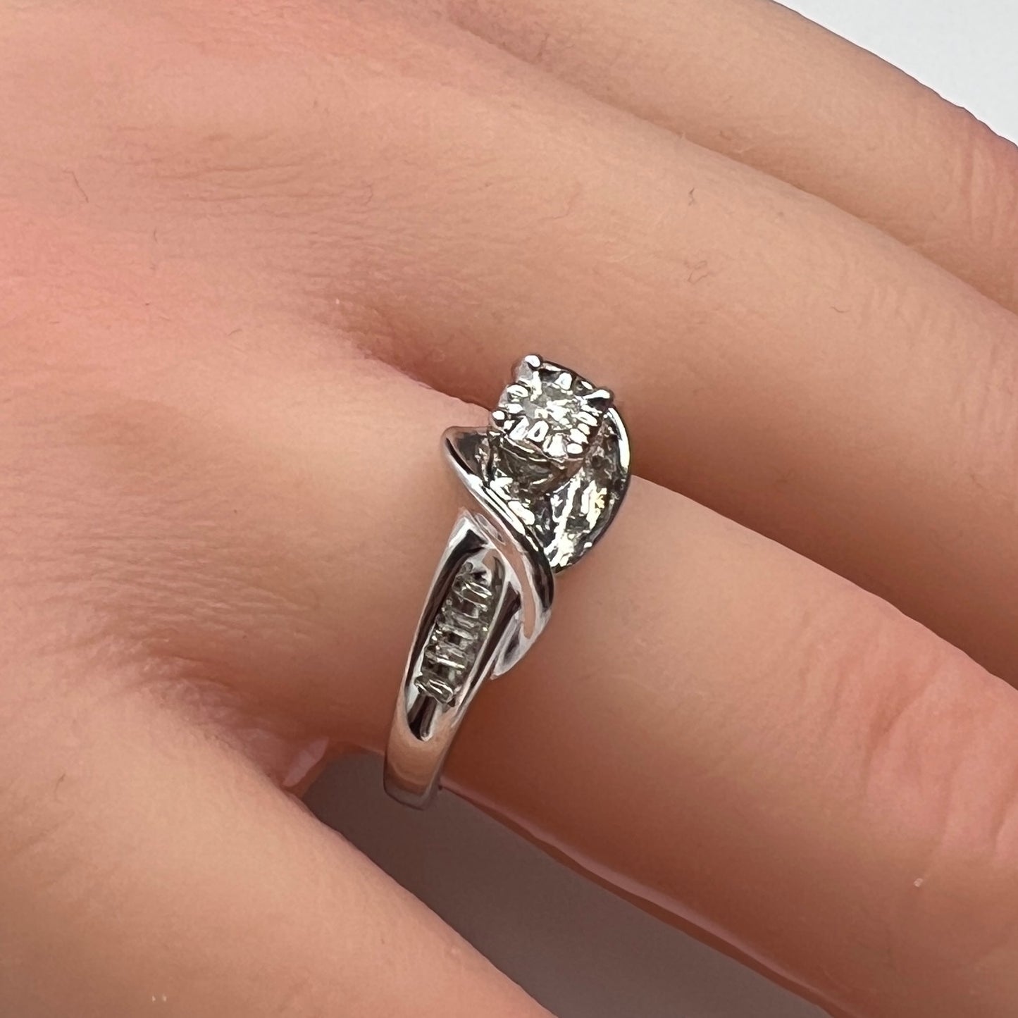 Sterling silver diamond ring by Forever Bride shown on finger
