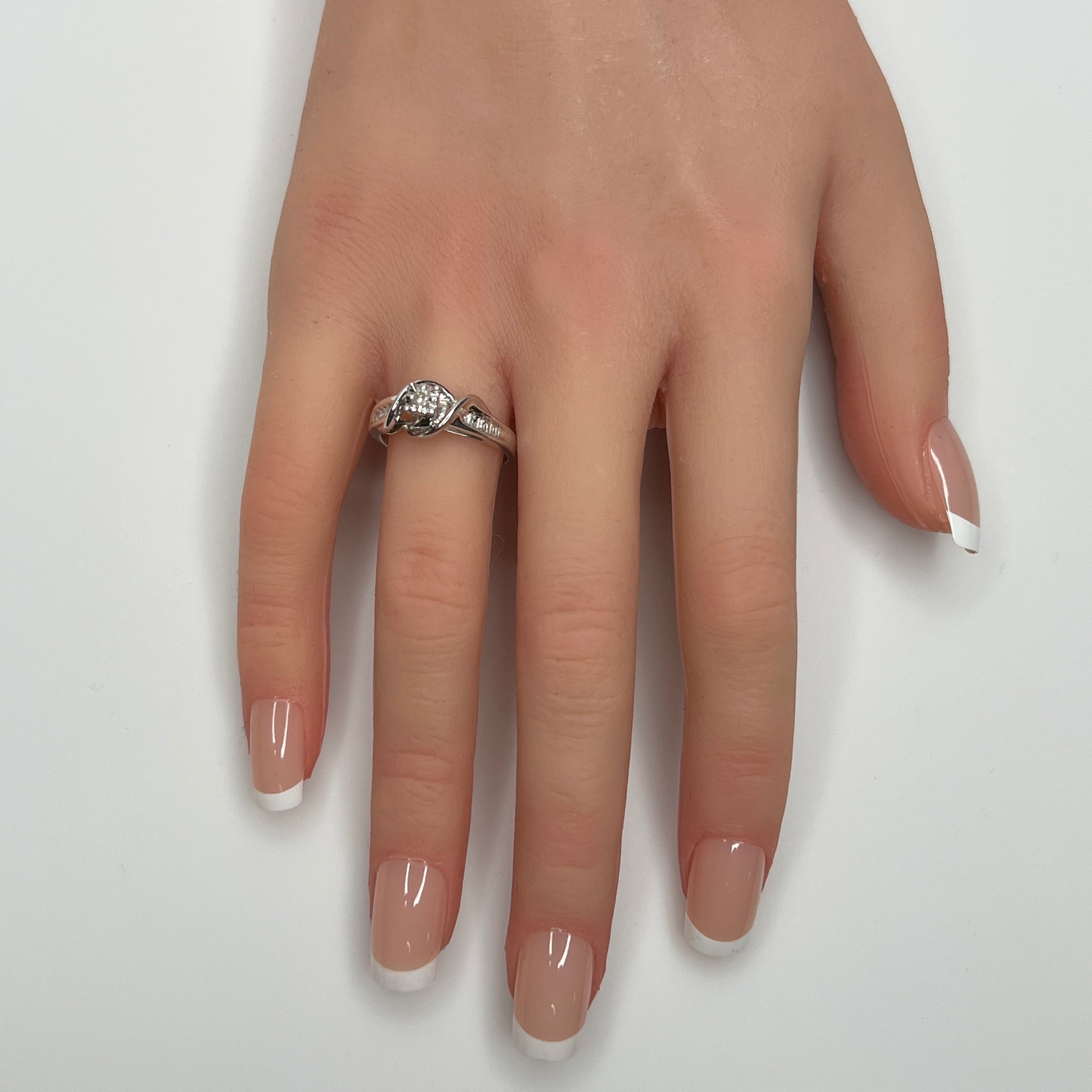 Sterling silver diamond ring by Forever Bride shown on finger