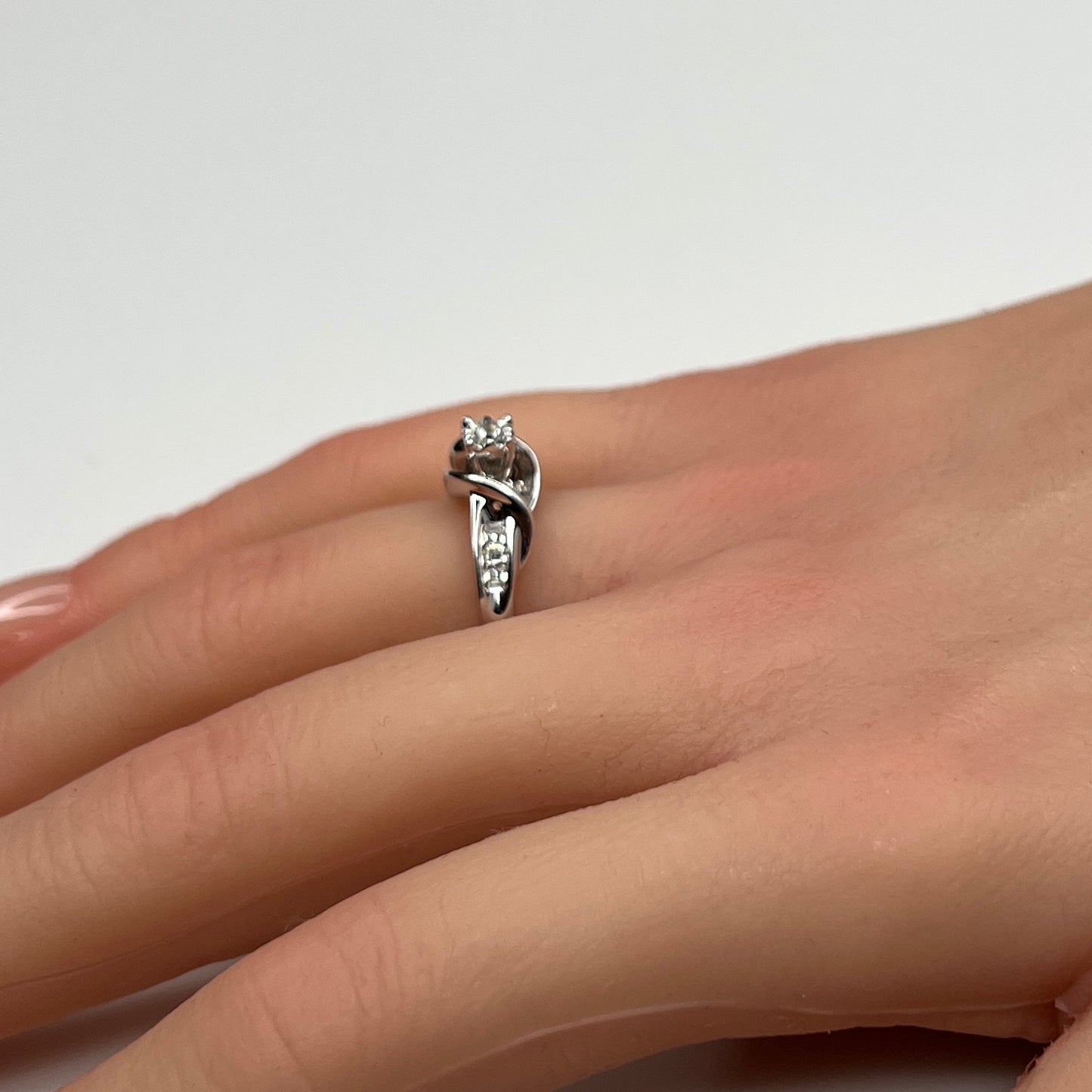 Sterling silver diamond ring by Forever Bride shown on finger