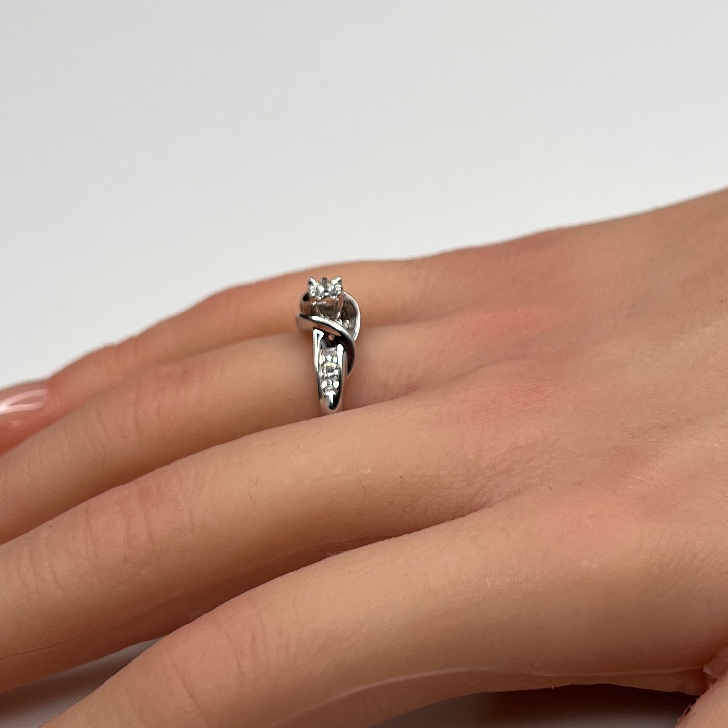 Sterling silver diamond ring by Forever Bride shown on finger