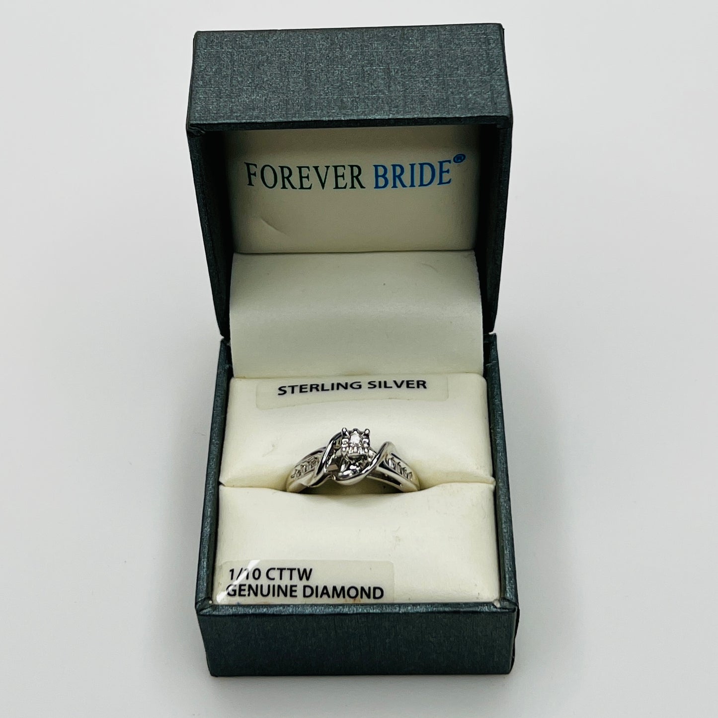 Ring in branded Forever Bride box with 1/10 CTTW diamond label