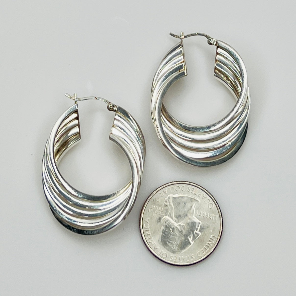 1980s sterling silver layered hoop earrings, flat lay view