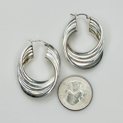 1980s sterling silver layered hoop earrings, flat lay view