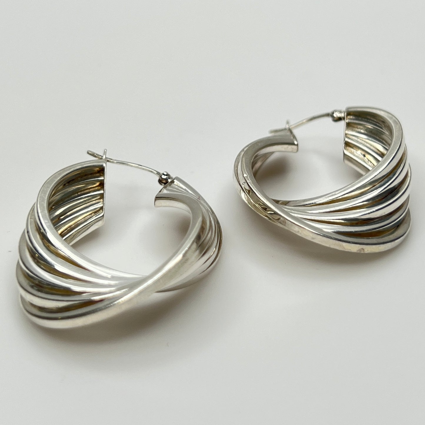 Side angle showing curved sterling hoop earring shape