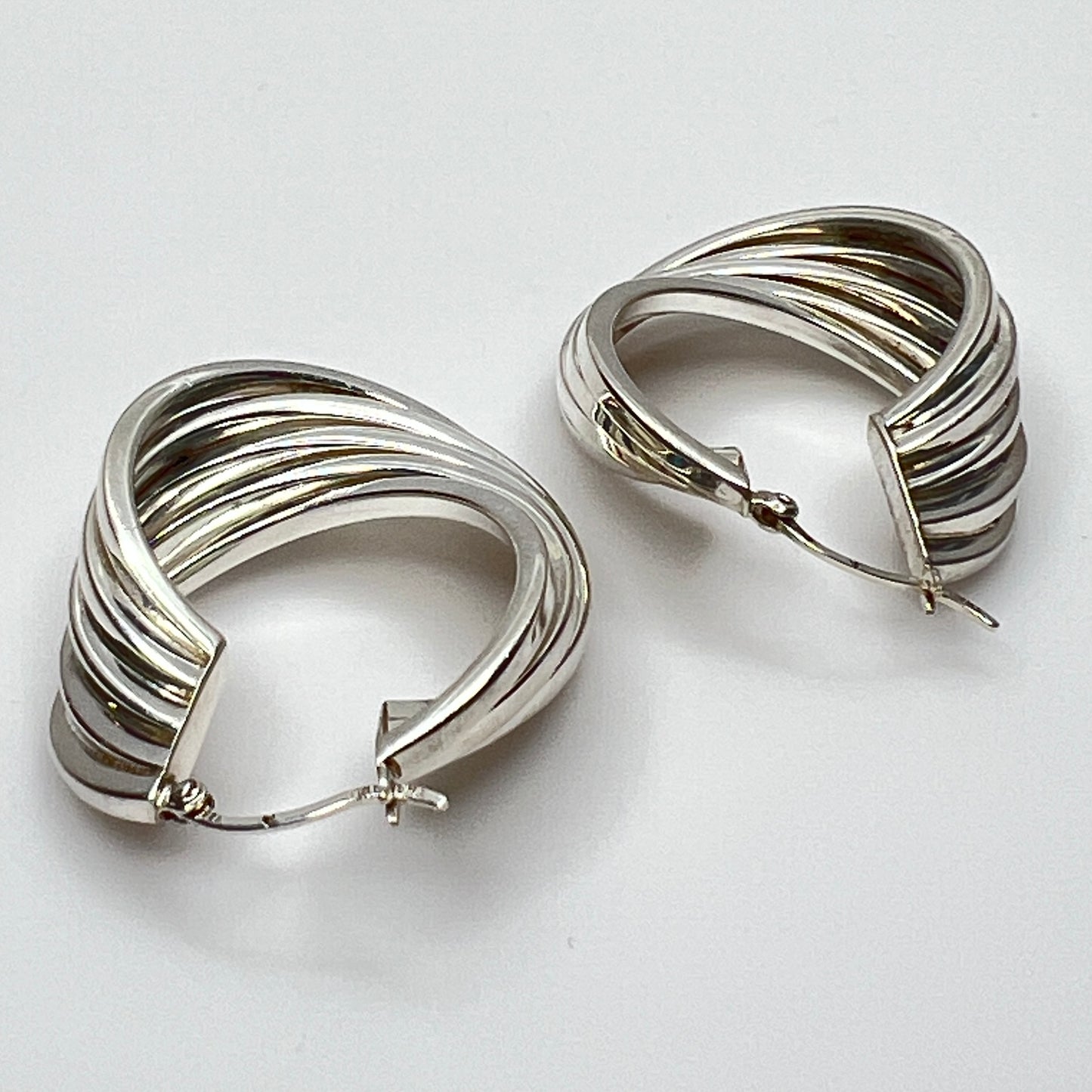 Side angle showing curved sterling hoop earring shape