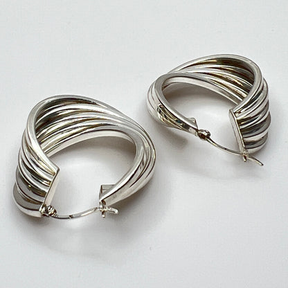 Side angle showing curved sterling hoop earring shape