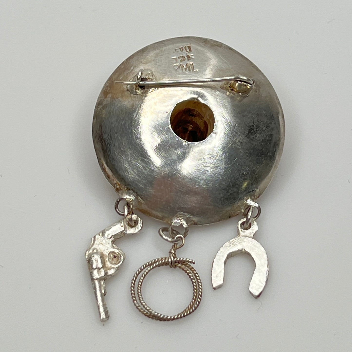 Close-up of brooch reverse stamped PERU 925 PML with C-clasp pin