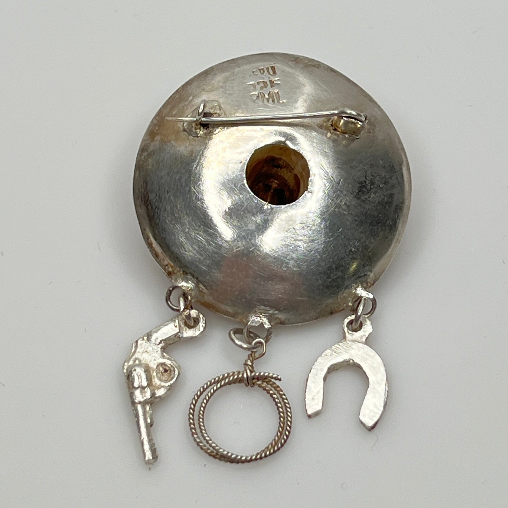 Close-up of brooch reverse stamped PERU 925 PML with C-clasp pin