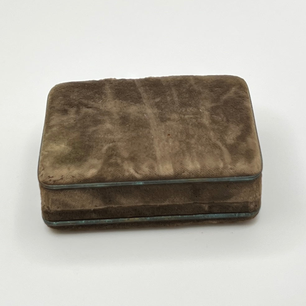 Brown velvet jewelry box on a white background