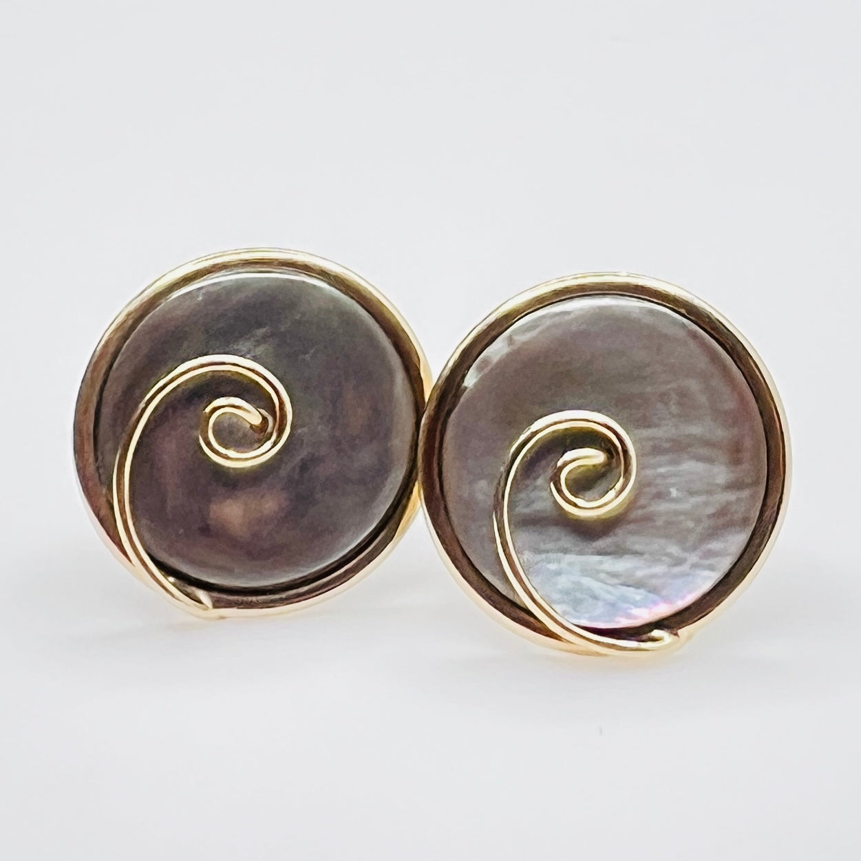 Round abalone cufflinks with gold swirl overlay, iridescent finish, 1960s Swank design