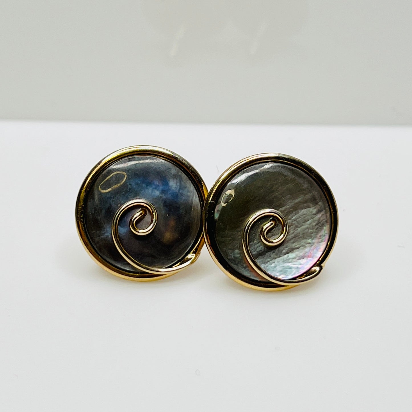 Round abalone cufflinks with gold swirl overlay, iridescent finish, 1960s Swank design