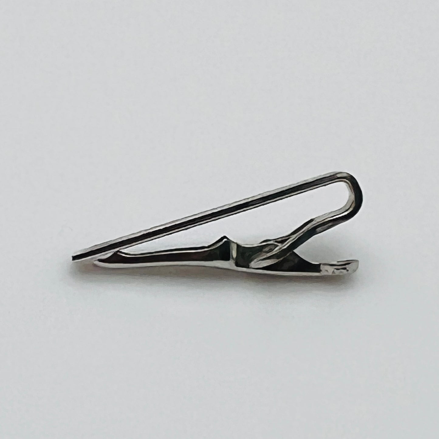 Brushed silver-tone Swank tie clip with etched fanburst detail, Mid-Century style