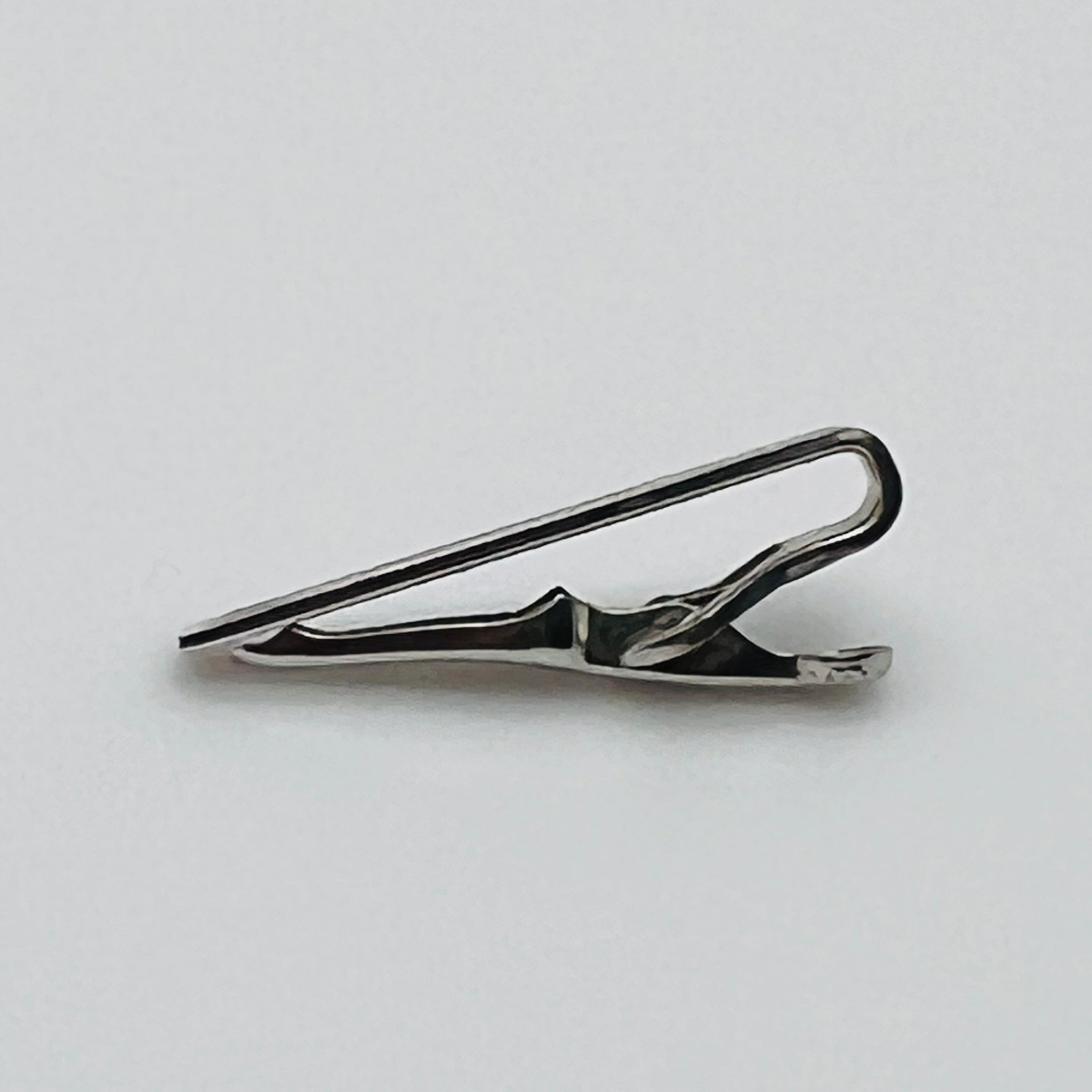 Brushed silver-tone Swank tie clip with etched fanburst detail, Mid-Century style