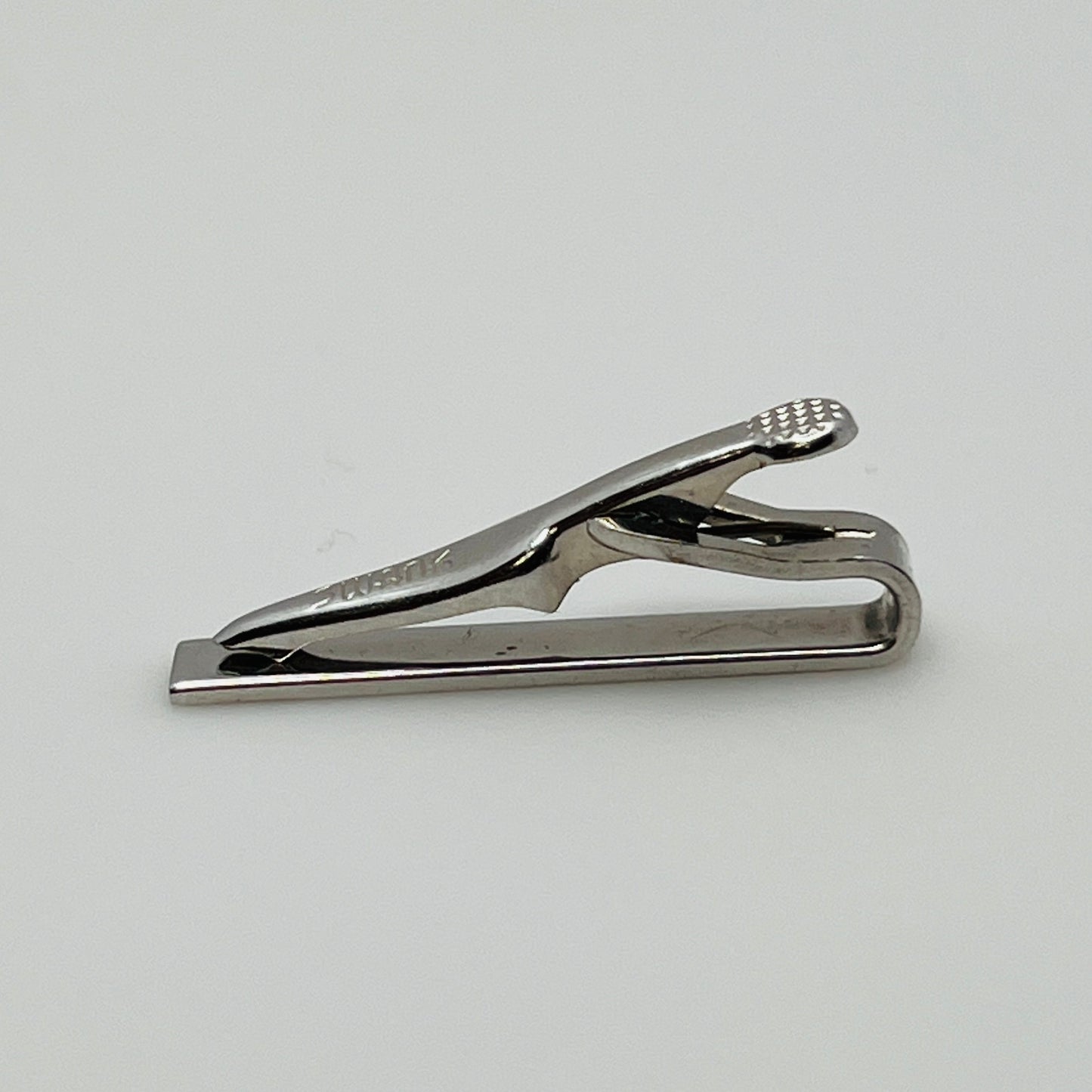 Brushed silver-tone Swank tie clip with etched fanburst detail, Mid-Century style
