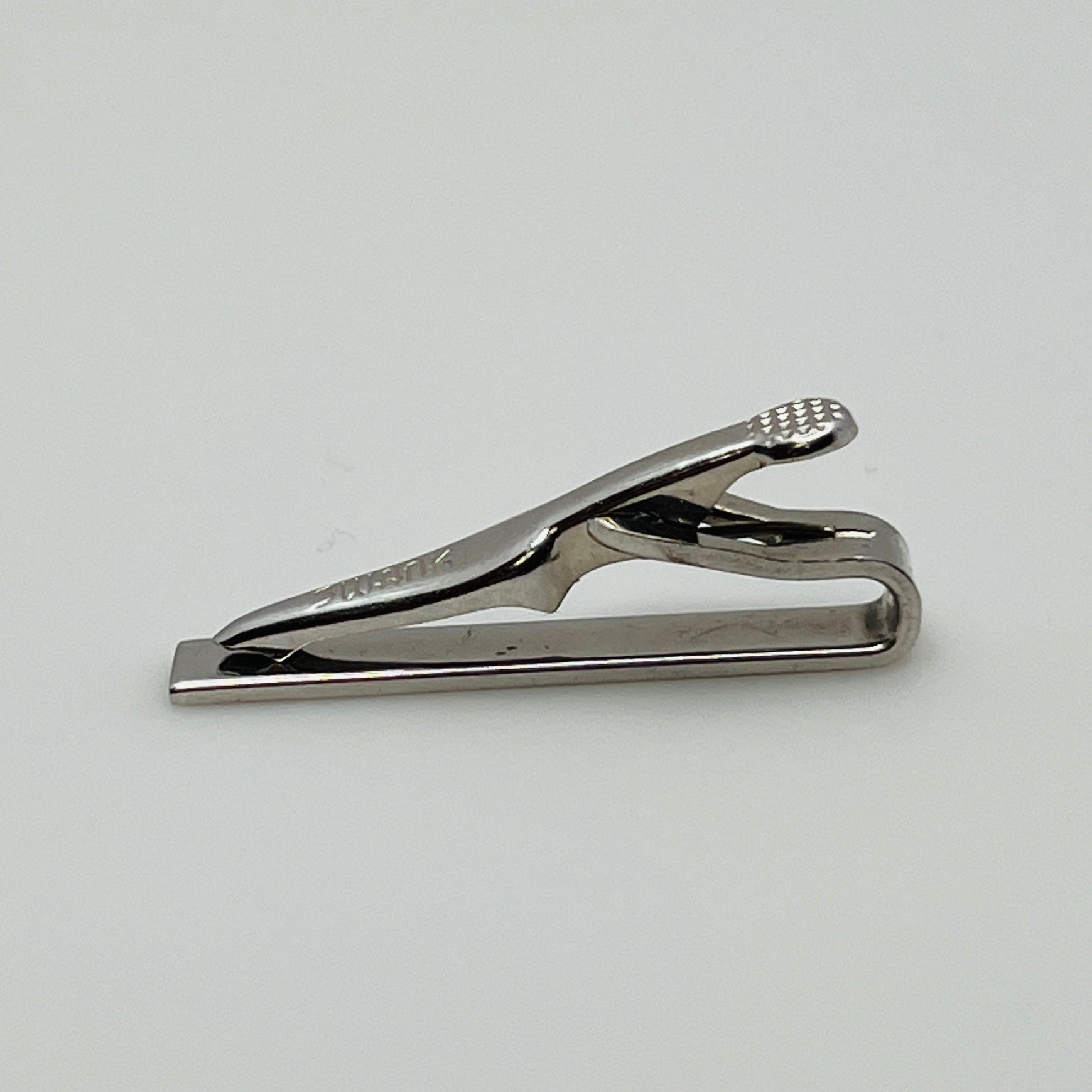 Brushed silver-tone Swank tie clip with etched fanburst detail, Mid-Century style