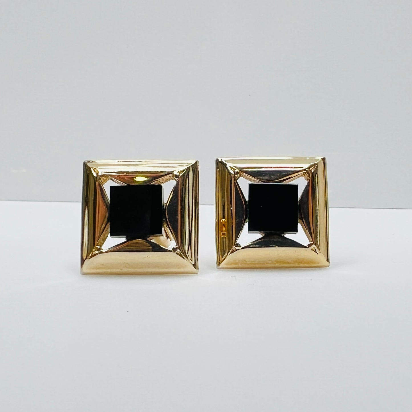 Gold-tone square cufflinks with black glass center, 1960s Mid-Century Modern style