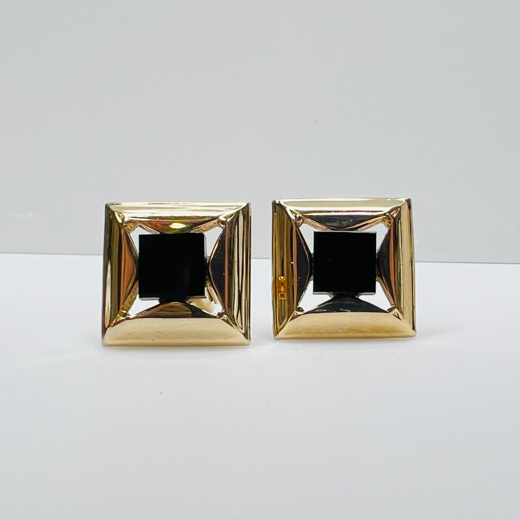 Gold-tone square cufflinks with black glass center, 1960s Mid-Century Modern style