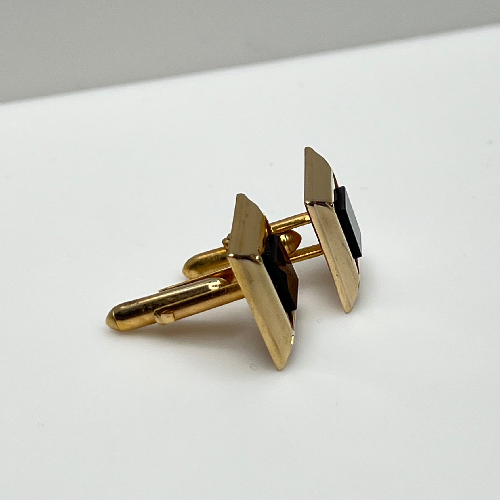 Gold-tone square cufflinks with black glass center, 1960s Mid-Century Modern style