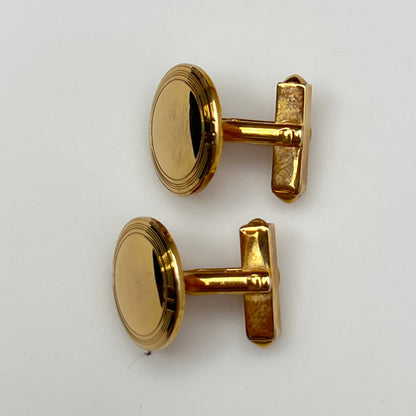 Pair of vintage goldtone Swank cufflinks with round engraved face