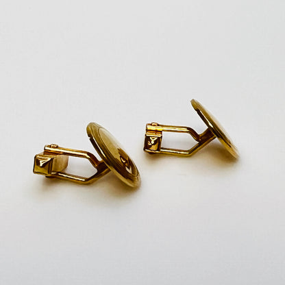 Pair of vintage goldtone Swank cufflinks with round engraved face