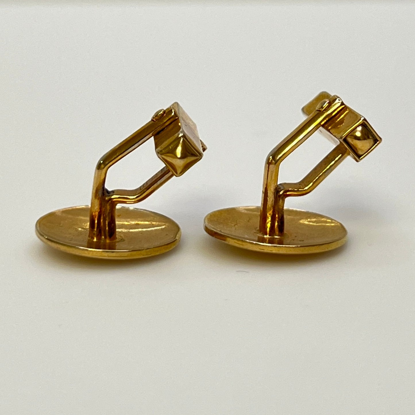 Pair of vintage goldtone Swank cufflinks with round engraved face