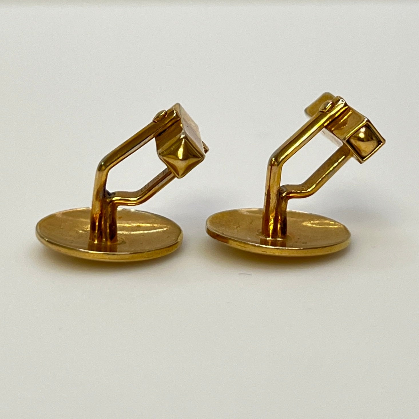 Pair of vintage goldtone Swank cufflinks with round engraved face