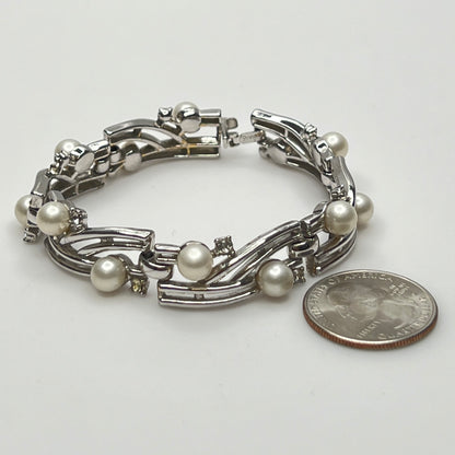 Trifari vintage bracelet with wavy silver panels and pearls laid flat