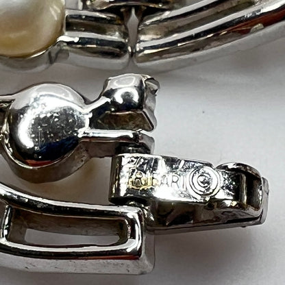 Trifari vintage bracelet with wavy silver panels and pearls laid flat