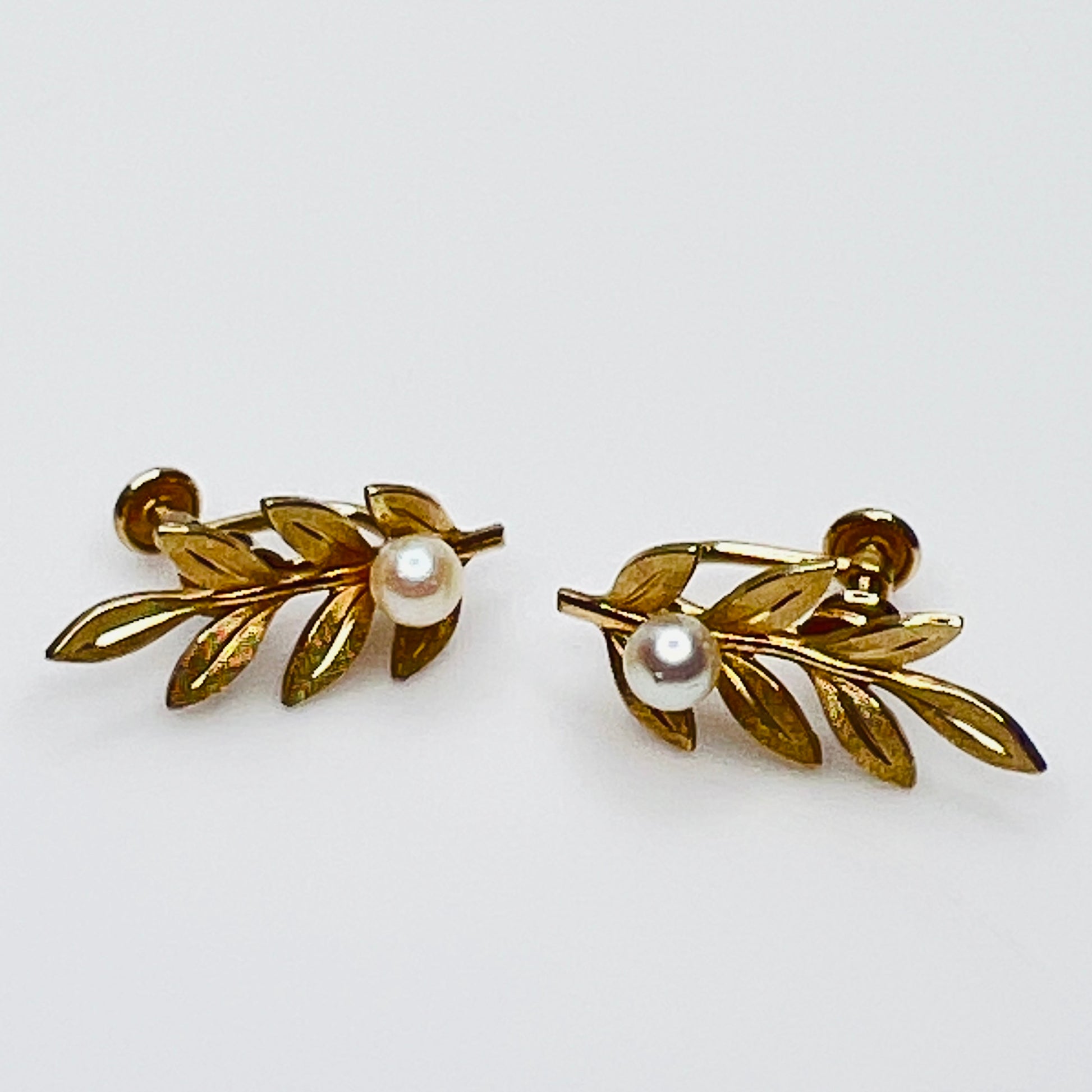Van Dell screw-back earrings with pearl accents and gold leaf design