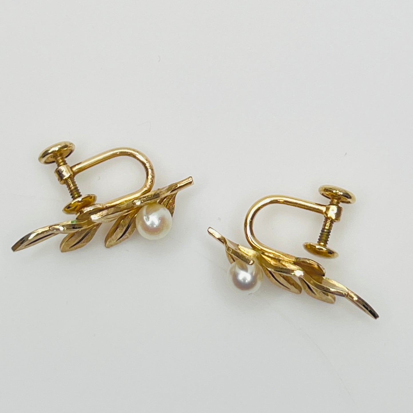 Van Dell screw-back earrings with pearl accents and gold leaf design