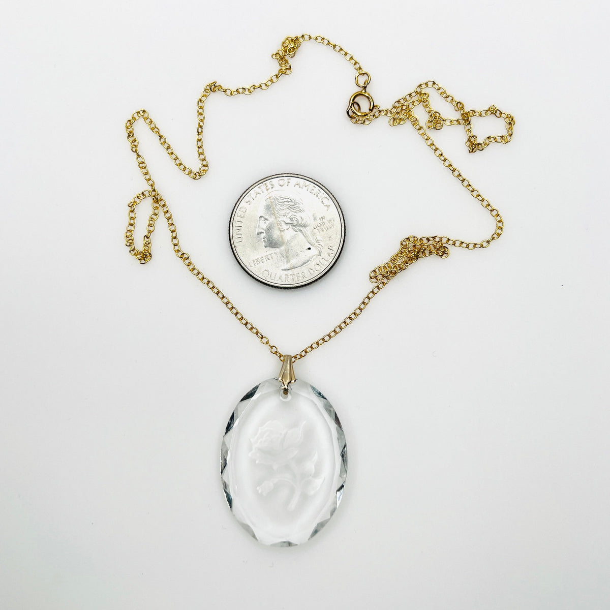 Vintage reverse carved crystal rose necklace with 14K gold filled cable chain and spring ring clasp, photographed beside quarter for scale.