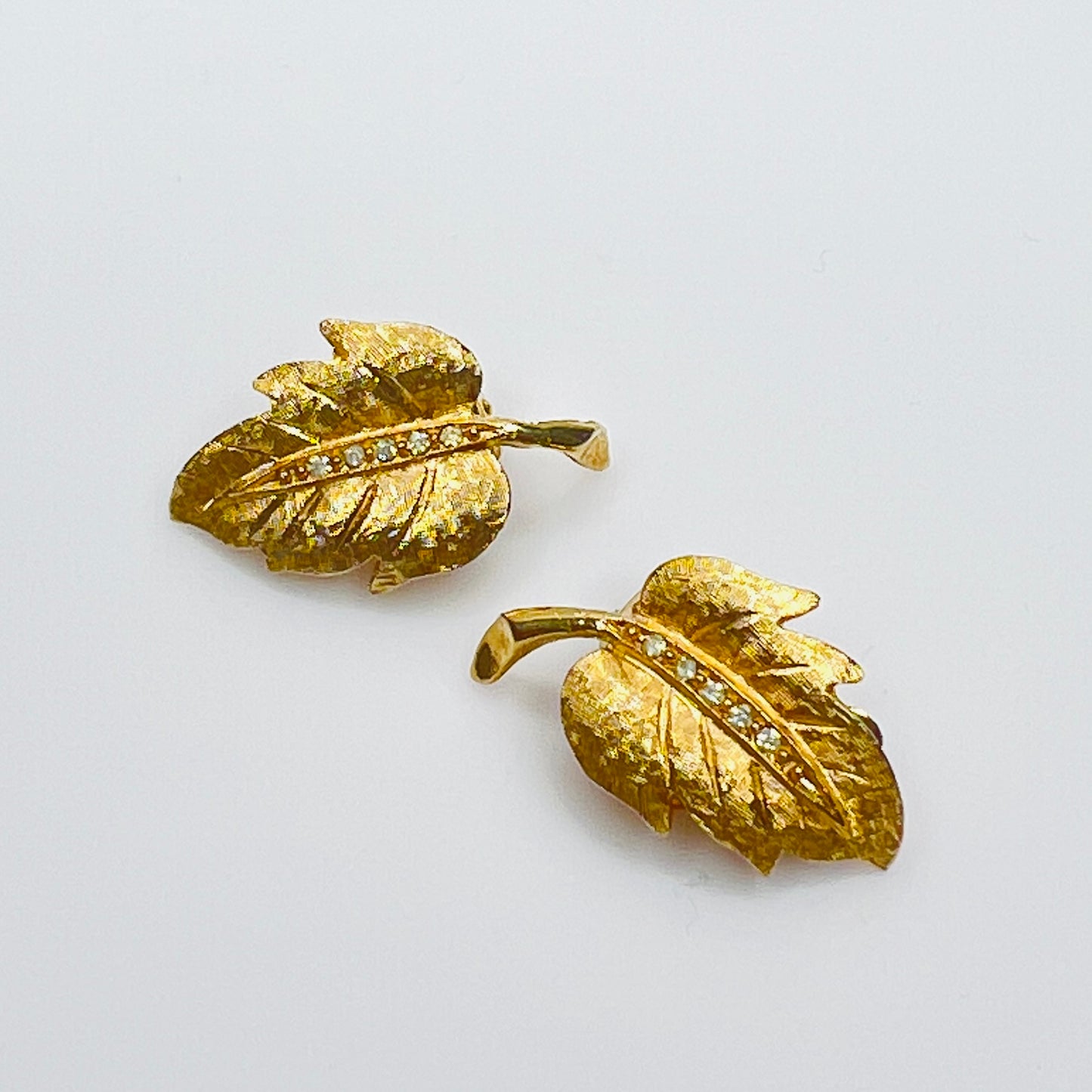 Vintage Charel gold leaf rhinestone clip earrings
