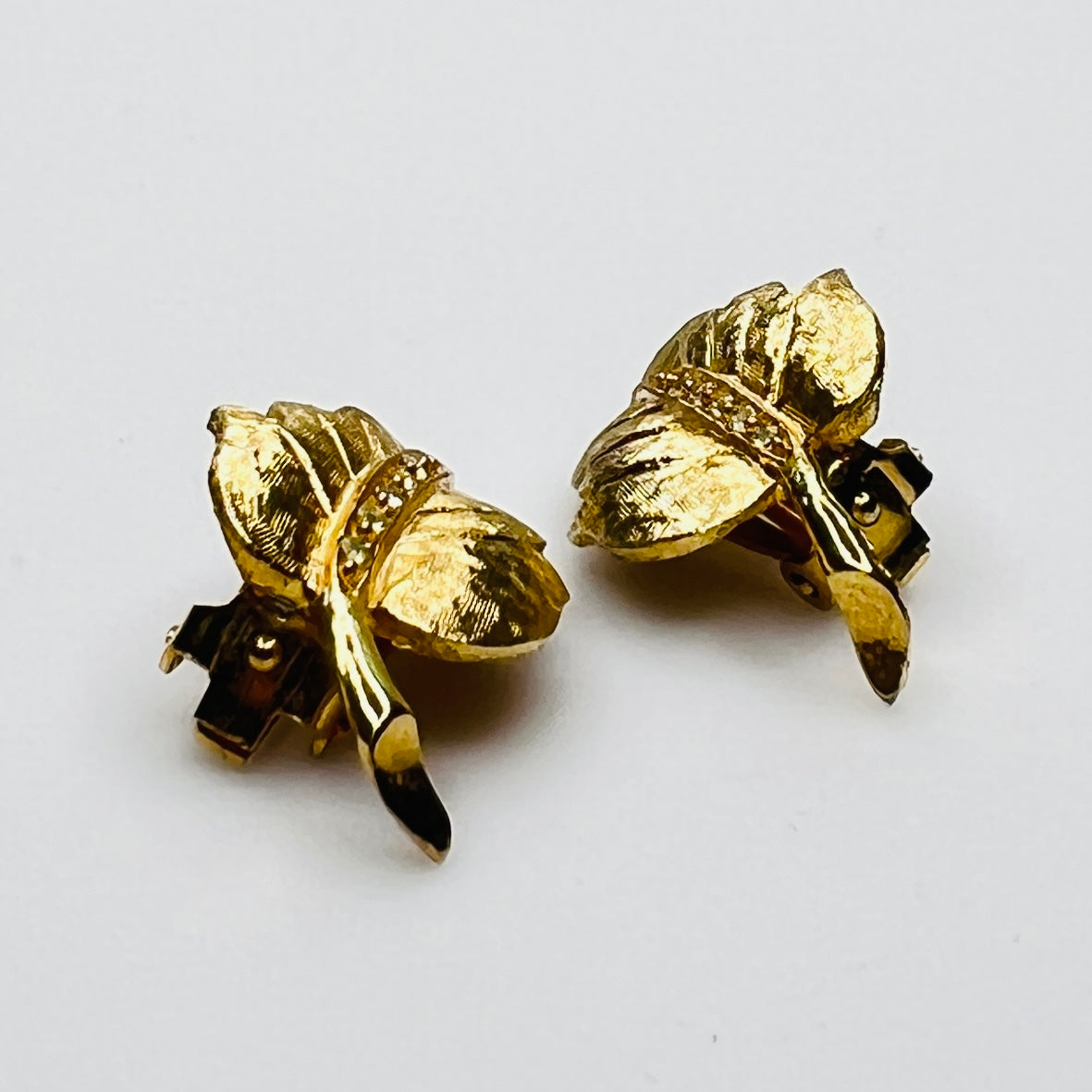 Side profile of vintage gold leaf clip-on earrings