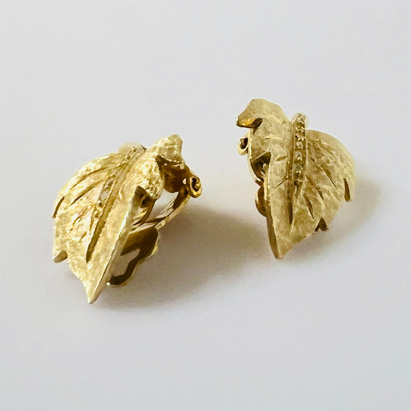 Side profile of vintage gold leaf clip-on earrings