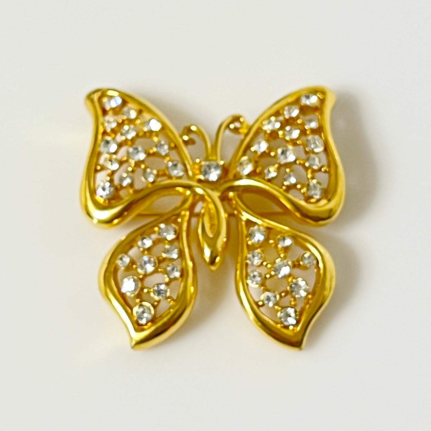 Vintage Monet gold tone rhinestone butterfly brooch