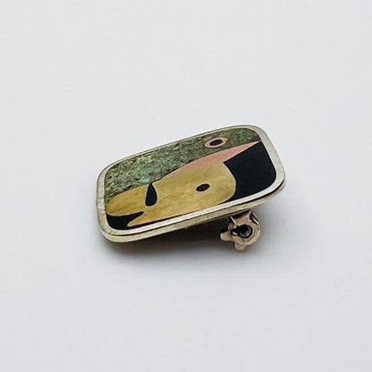 Side view of Taxco mixed metal artisan brooch
